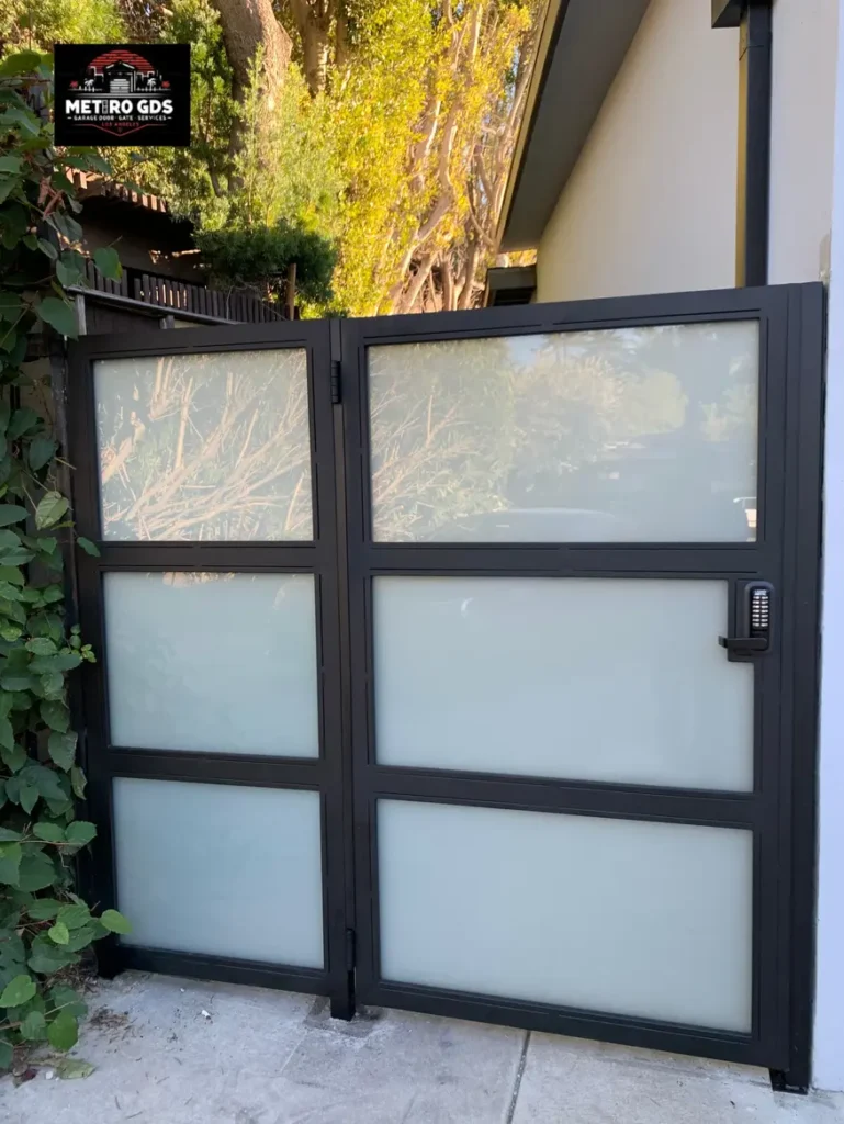 modern double-panel metal gate with frosted glass, installed by Metro GDS