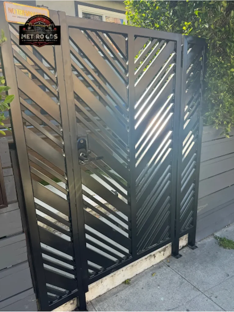 Sleek black metal gate with a diamond pattern installed by Metro GDS Inc
