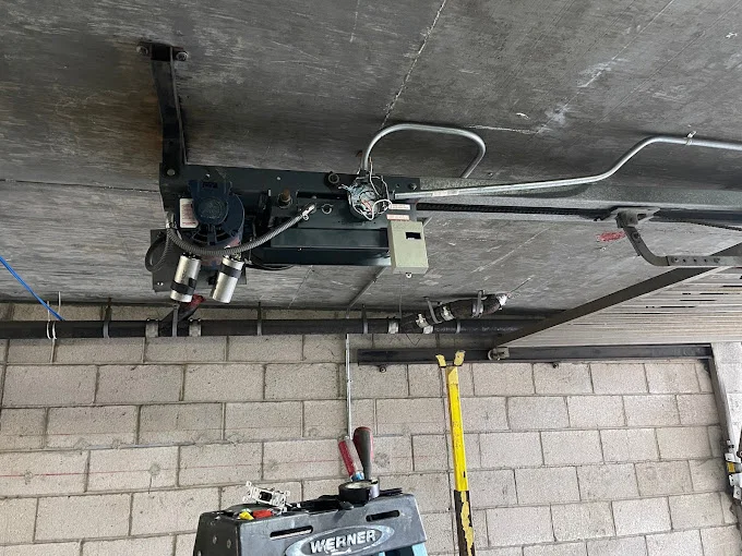 Garage door opener motor and mechanism installed by Metro GDS Inc