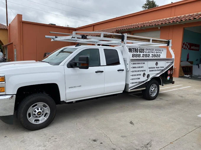 Metro GDS Inc white service truck with ladder