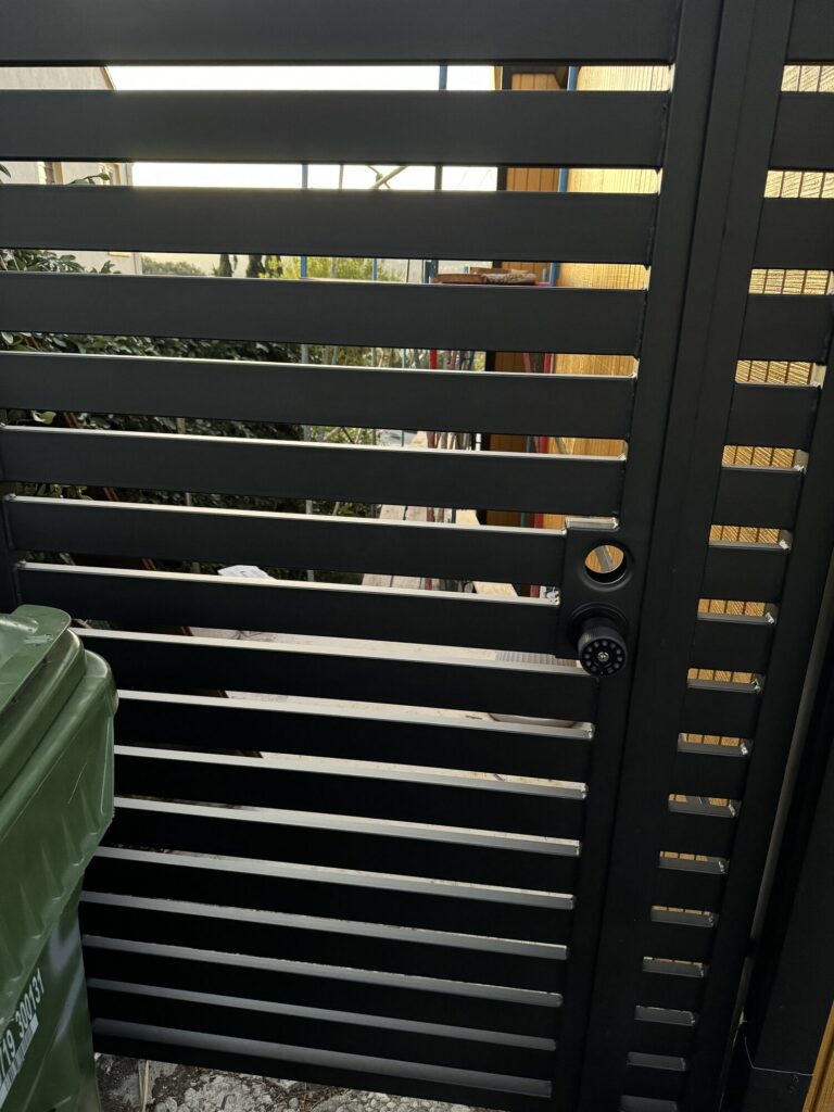 Close-up of a black horizontal slat gate installed by Metro GDS in Los Angeles