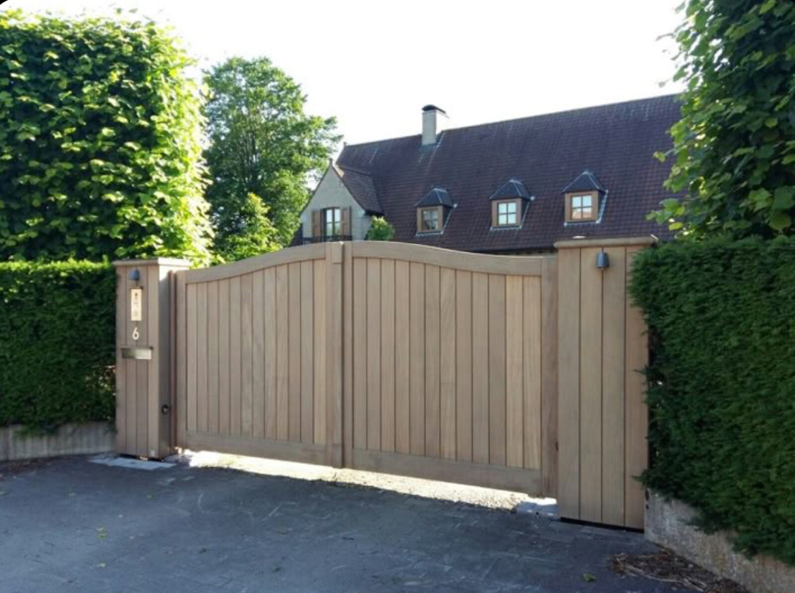 Wood double swing driveway gate installed by Metro GDS in Los Angeles
